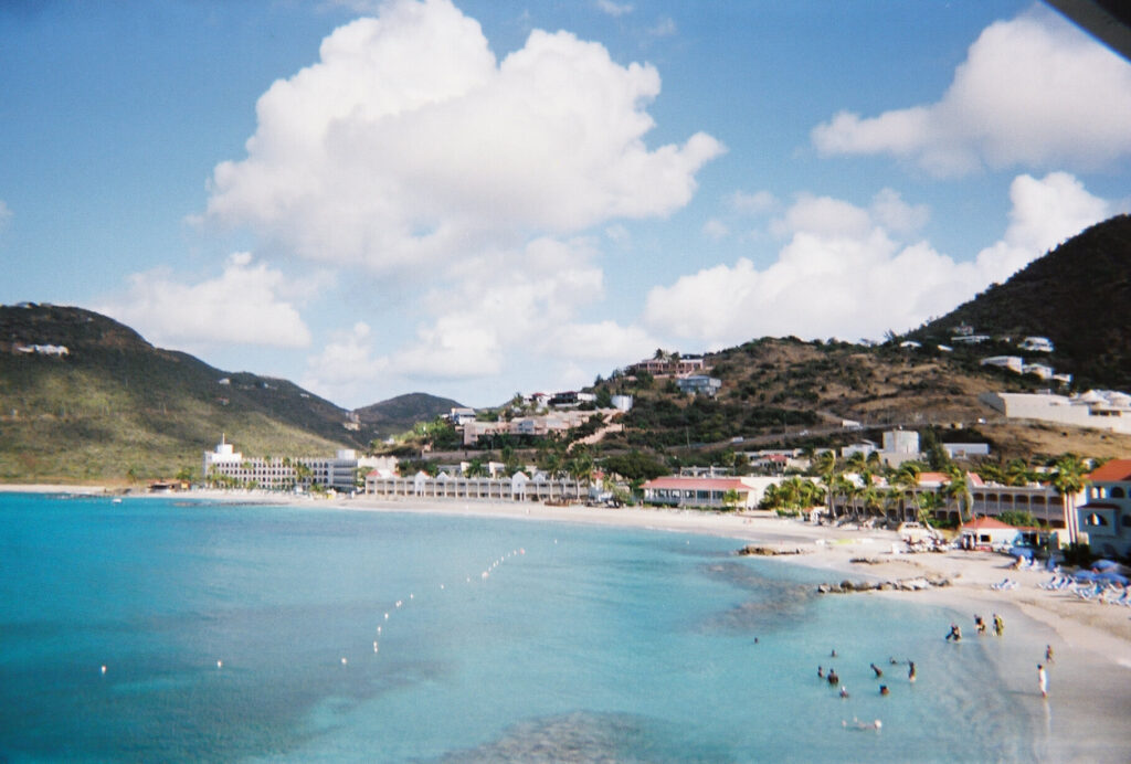 Panoramic view of Great Bay, Sint Maarten, with hillside homes above the beach