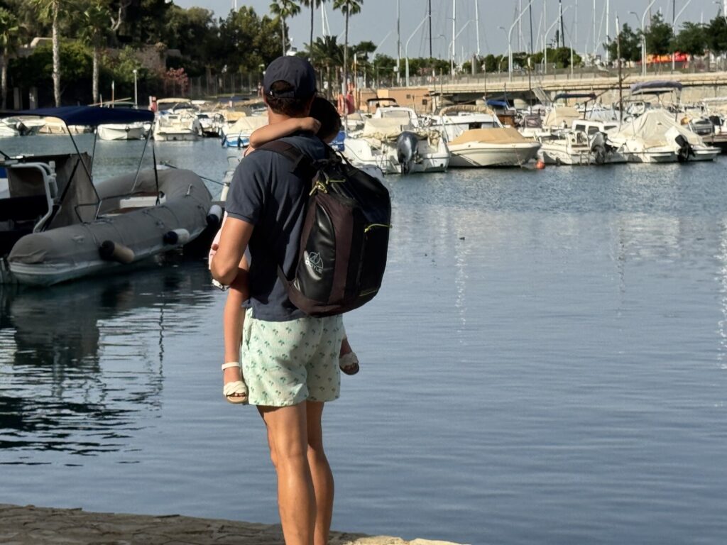 Garry carrying Coco near the marina at Puerto Portals